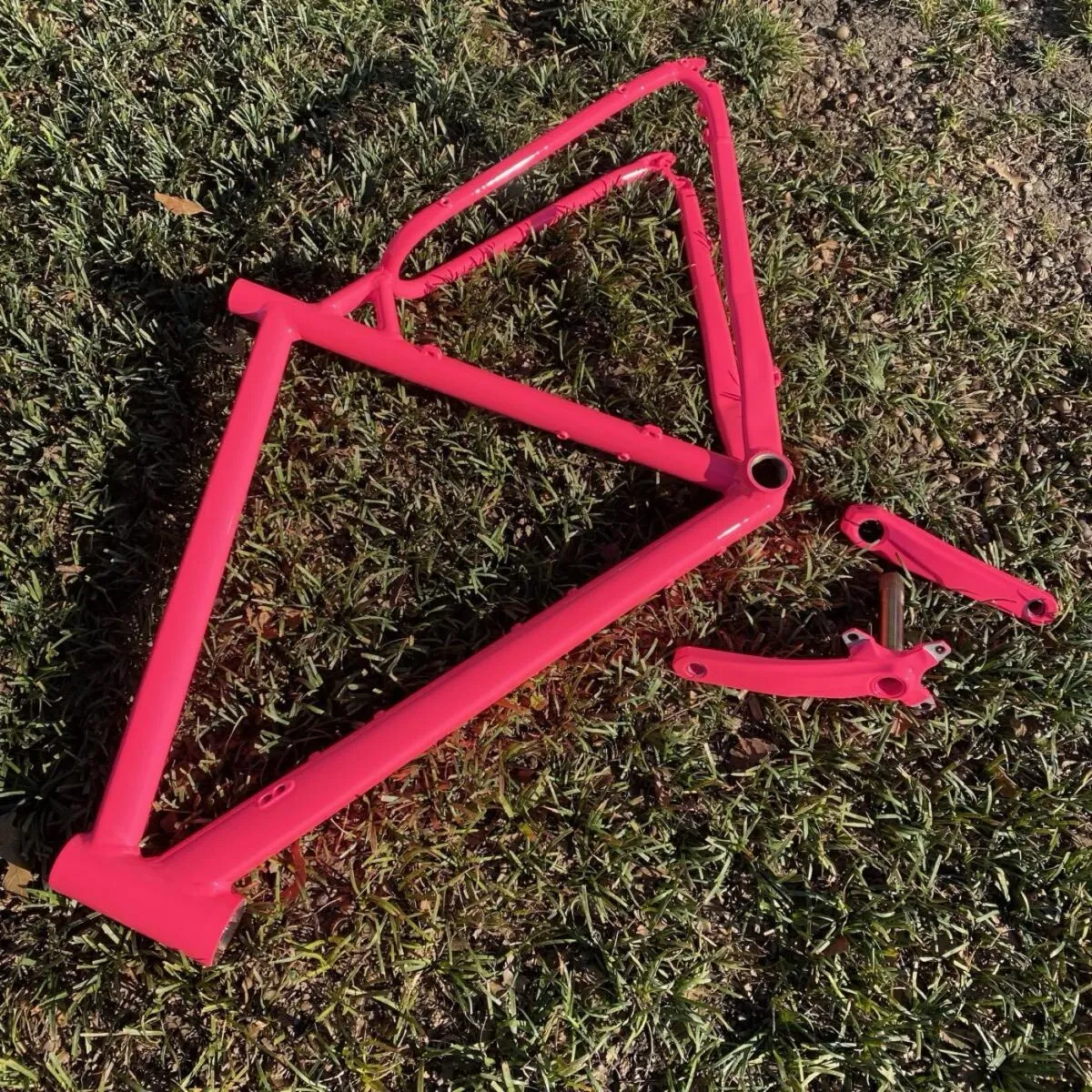 Bicycle frame in a magenta gloss.