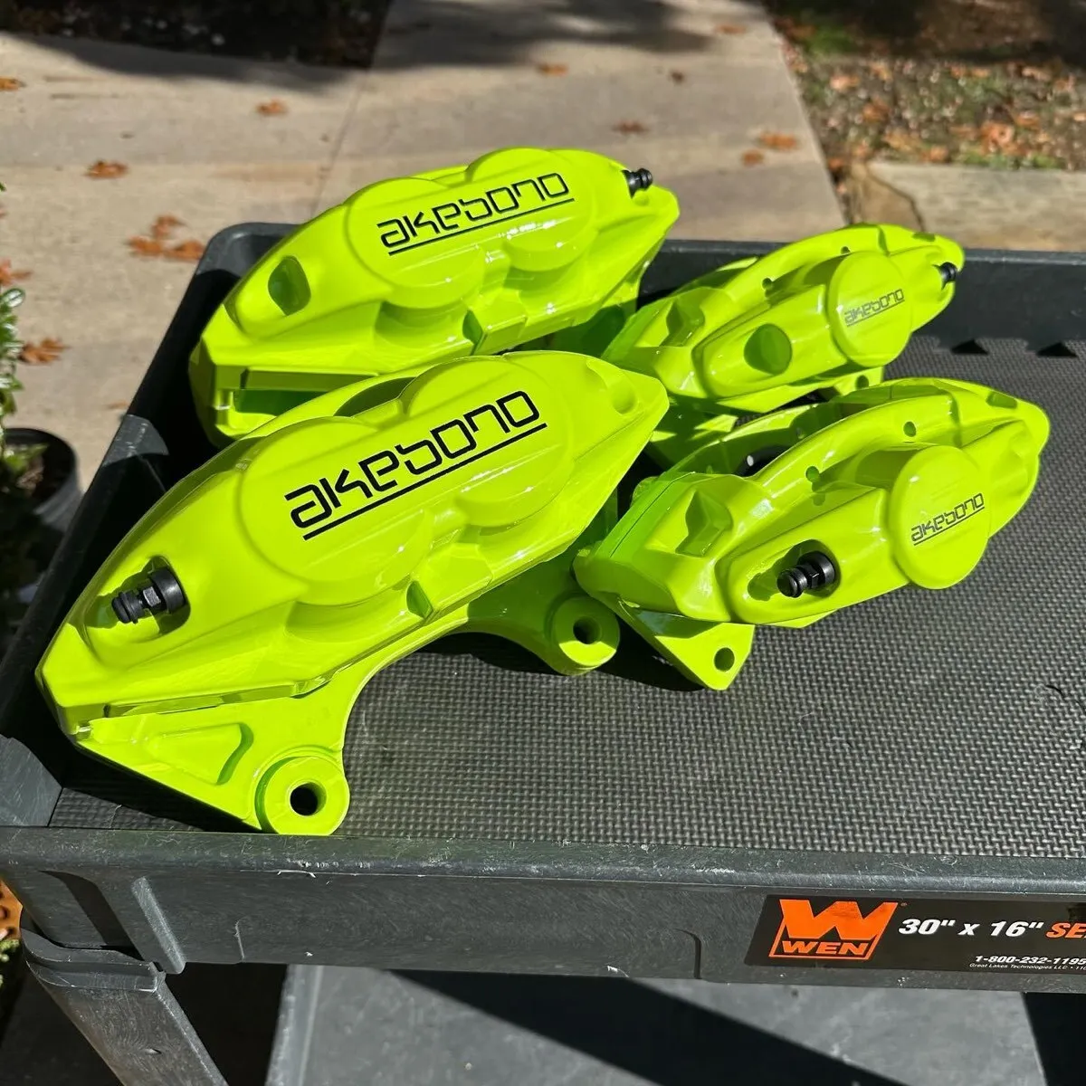 Akebono calipers in Chartreuse Sherbert.