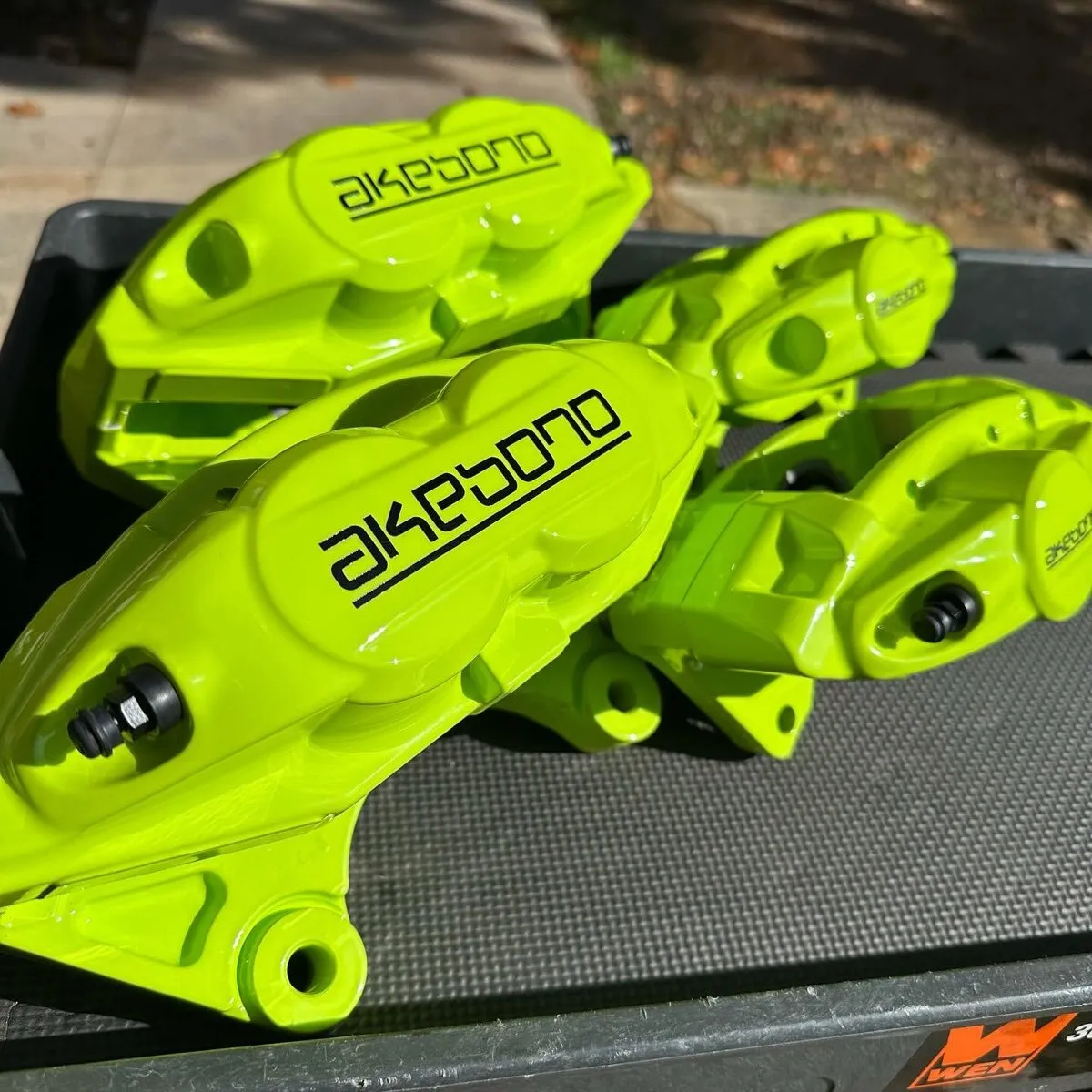 Akebono calipers in Chartreuse Sherbert.