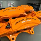 C8 Corvette calipers color-matched to Aztec Orange.