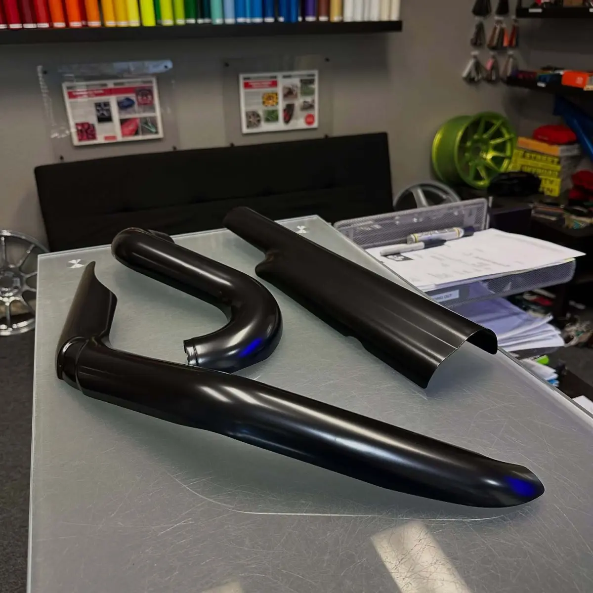 Heat shields refinished in Gloss Black Cerakote