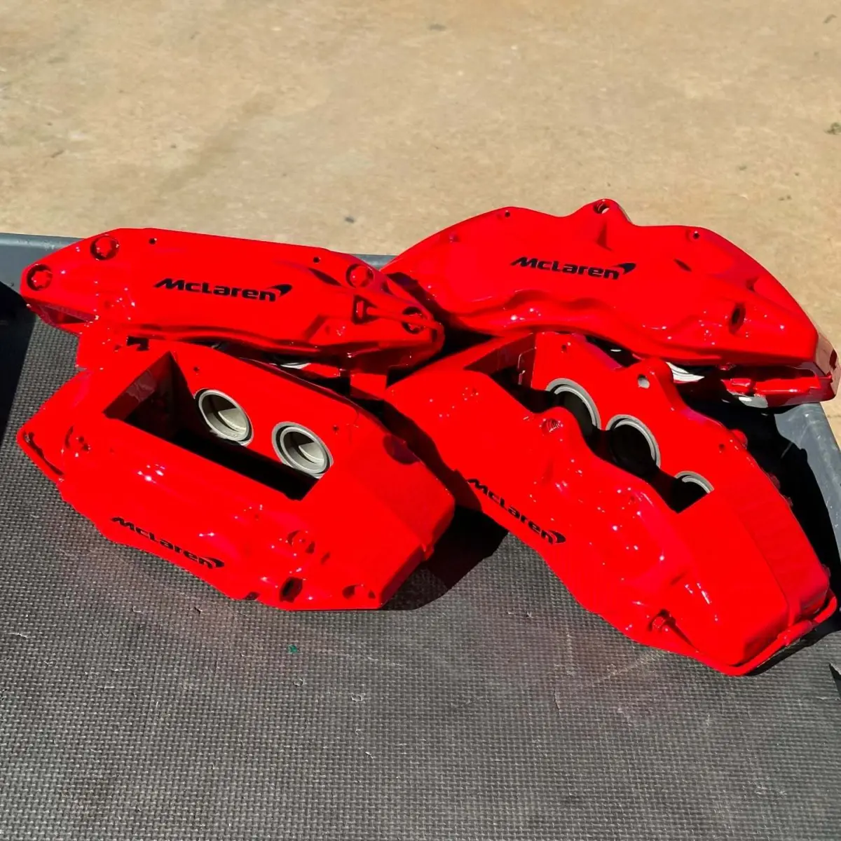 McLaren brake calipers refinished in Bengal Red with High Gloss Clear