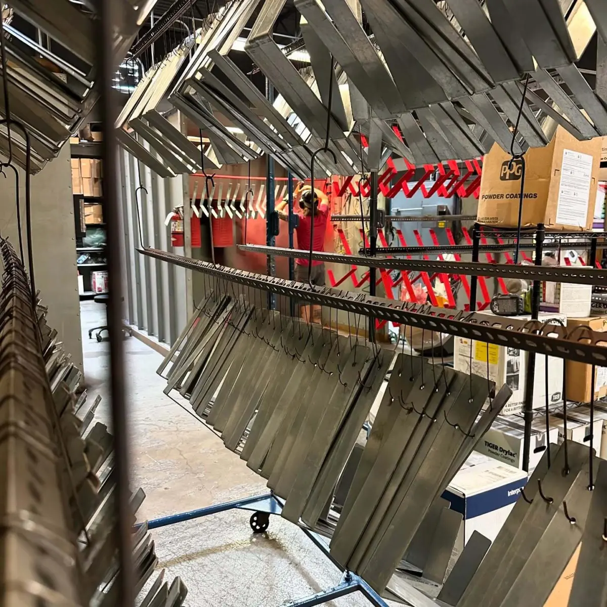 Large run of gutter brackets powder coated in RAL 3031 custom matte finish