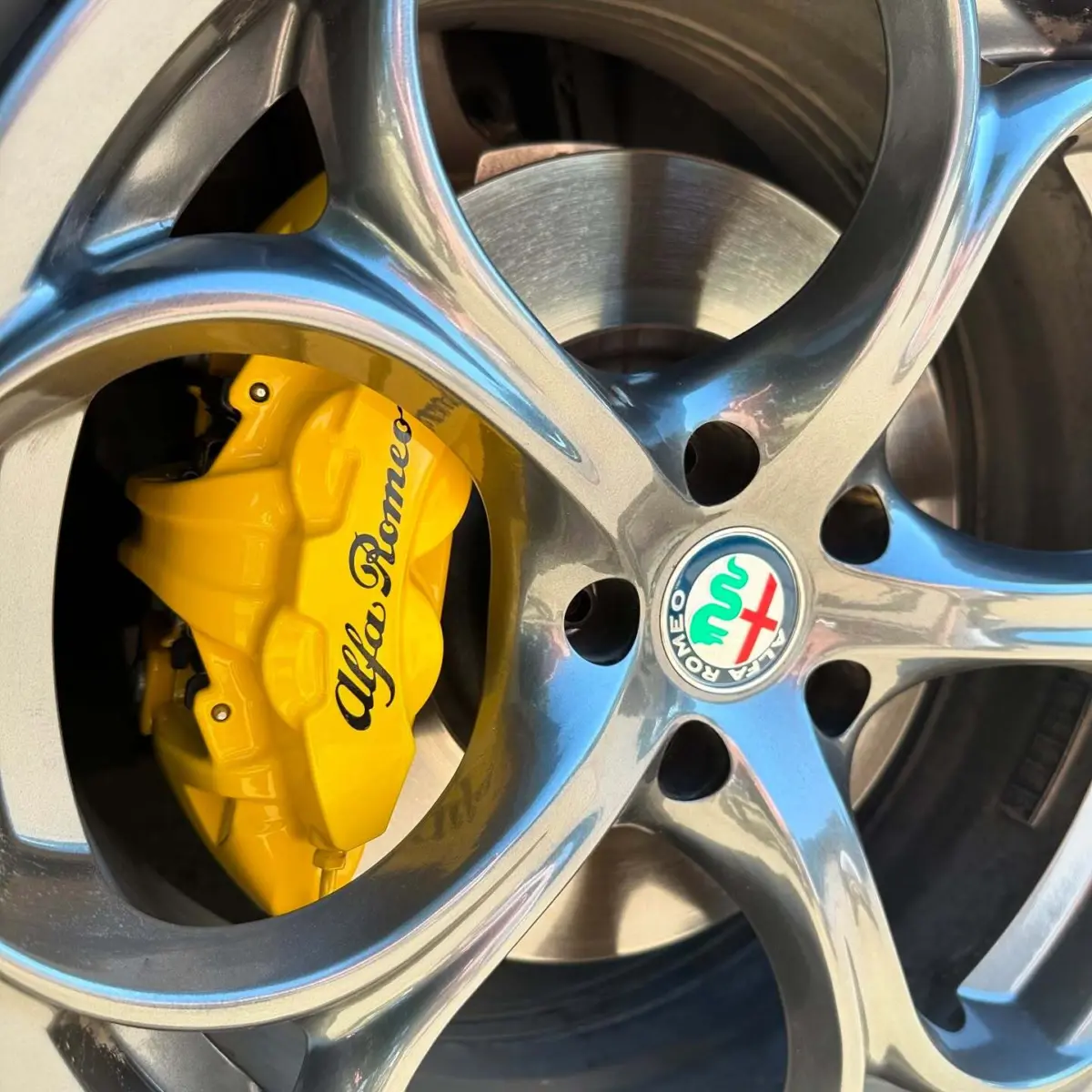2022 Alfa Romeo Guilia brake calipers refinished in Hot Yellow with High Gloss Clear