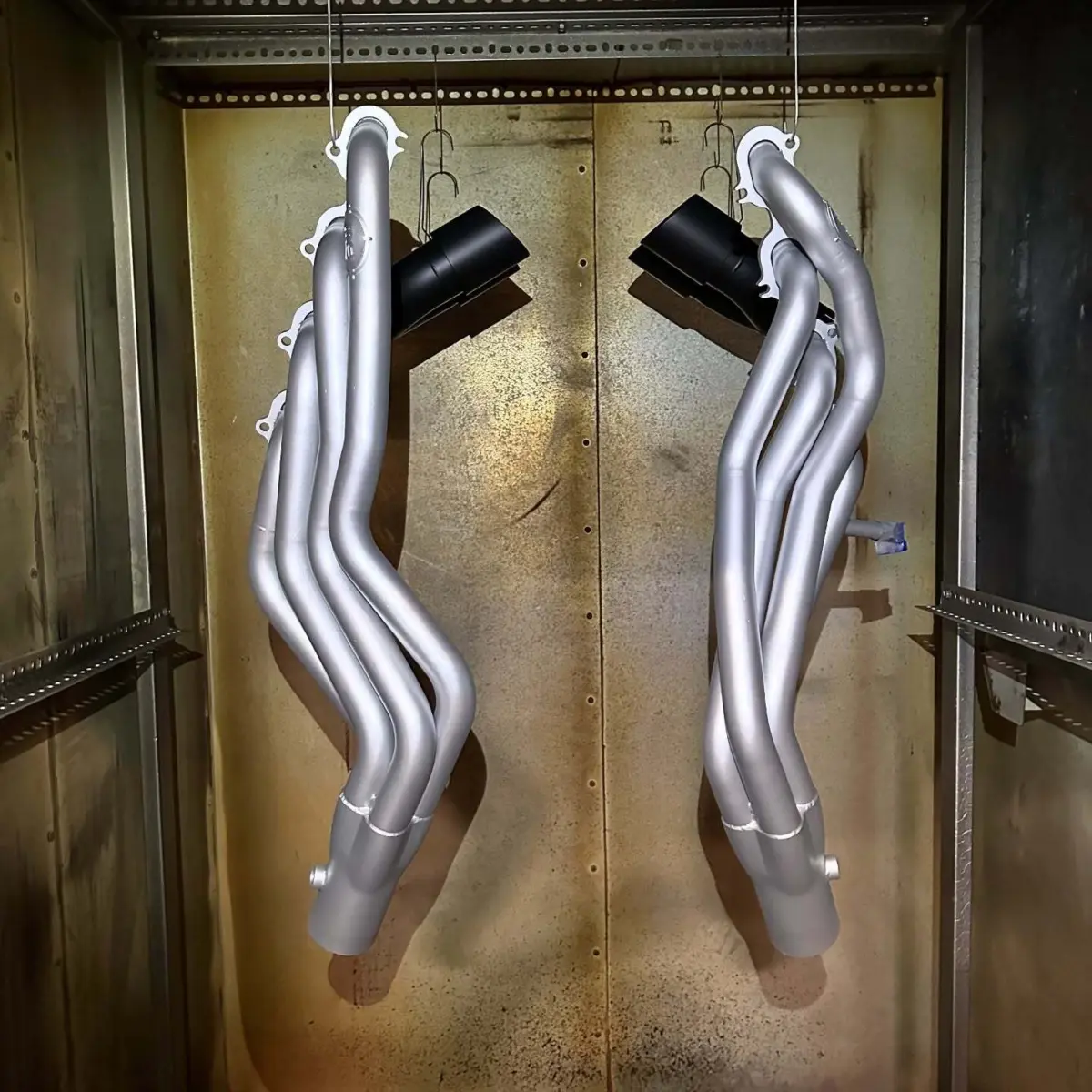 Headers refinished in Glacier Silver Cerakote, formulated for exhaust components that reach up to 1800 degrees