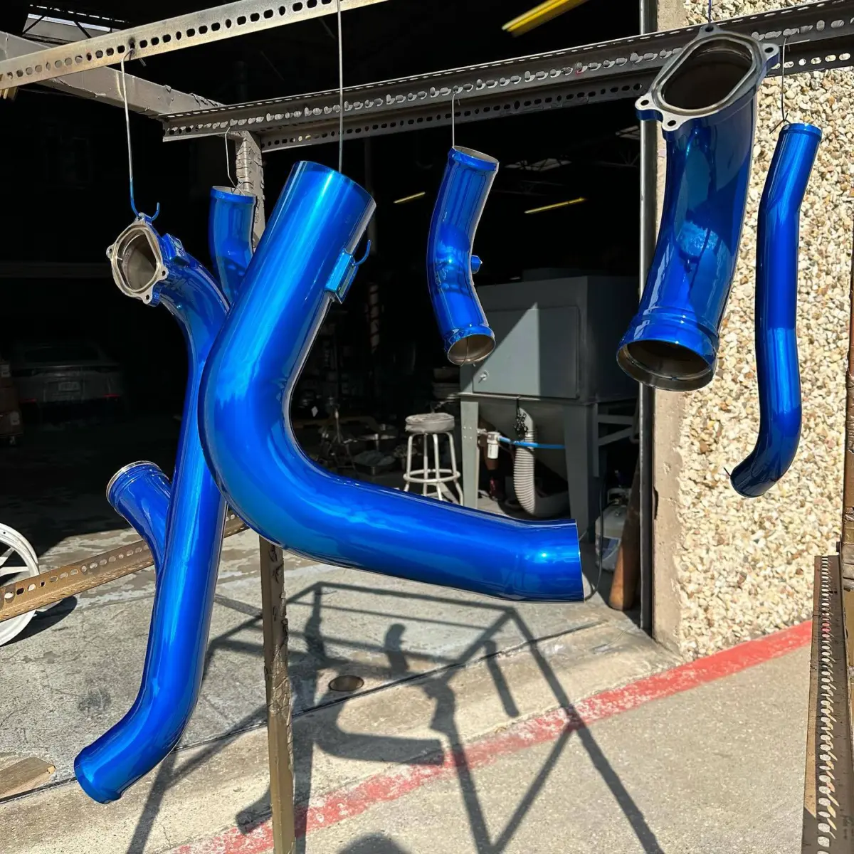Intercooler piping powder coated in 3 stage Peeka Blue over Super Chrome topped with High Gloss Clear
