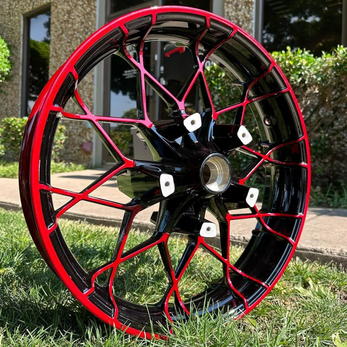Harley Davidson wheels refinished in Illusion Ruby and Gloss Black