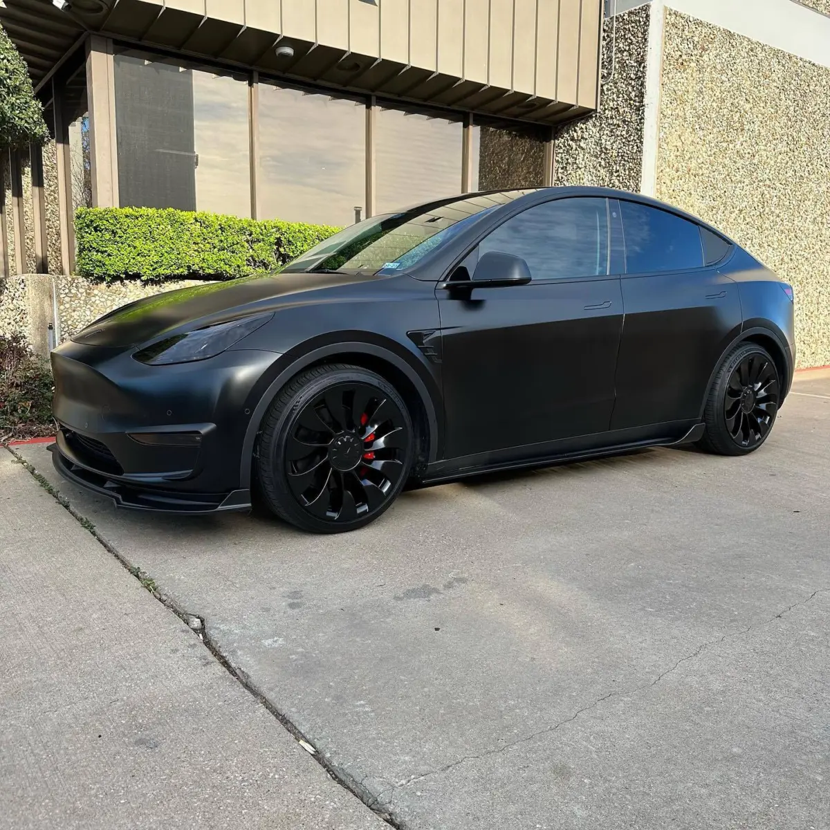 2022 Tesla Model Y wheels powder coated in Semigloss Black with painted to match center caps