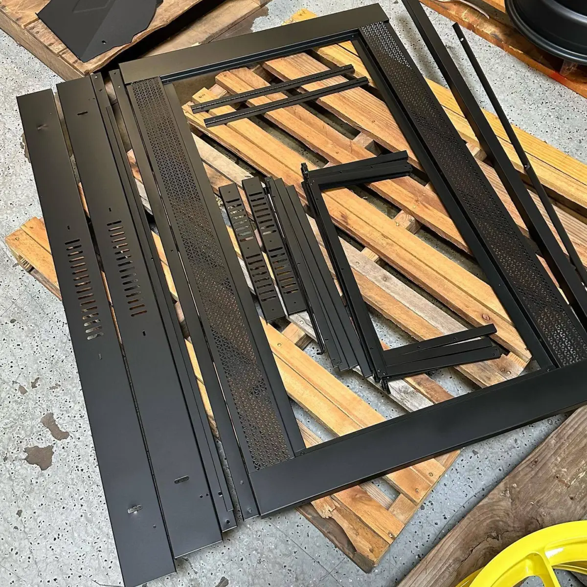 Fireplace trim powder coated in Denim Black. Swipe to see before pictures!