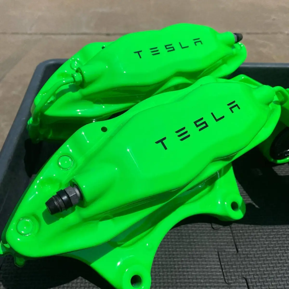 Tesla Model S brake calipers powder coated Neon Green with High Gloss Clear
