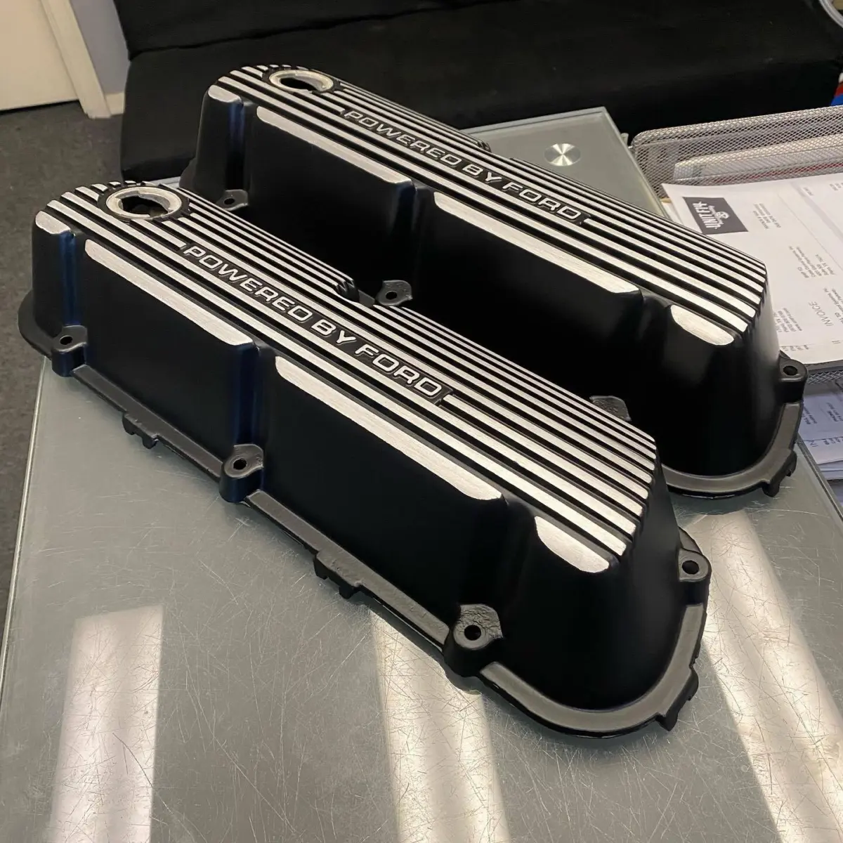 Mustang valve covers powder coated in Denim Black with Brushed Fins. Brackets and engine cover were vapor honed to restore to the original raw aluminum look