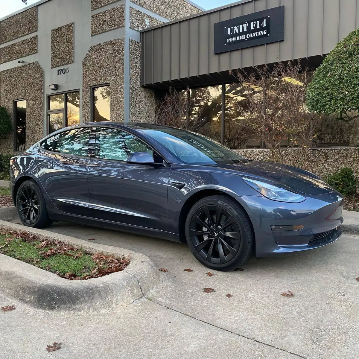 Tesla Model 3 wheels refinished in Denim Black