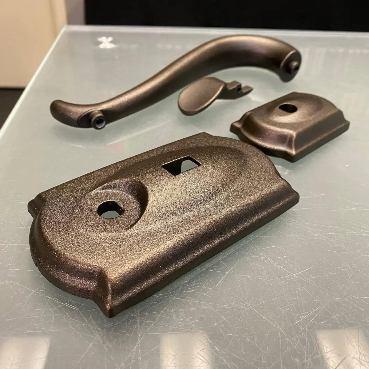 Door hardware refinished in Oil Rubbed Bronze