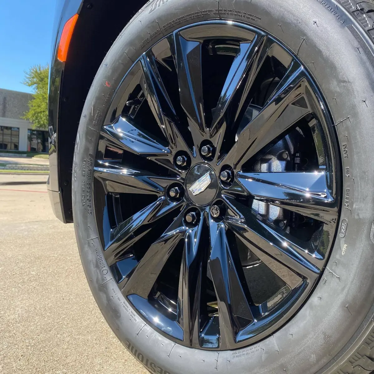 2021 Cadillac Escalade in for Super Mirror Black powder coated wheels matched with Black Chrome lug nuts