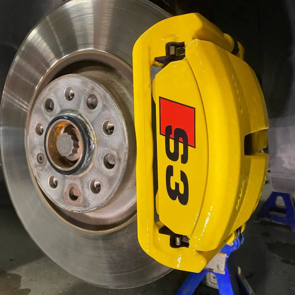 Audi S3 brake calipers refinished in Hot Yellow. Wheels refinished in Class A Silver