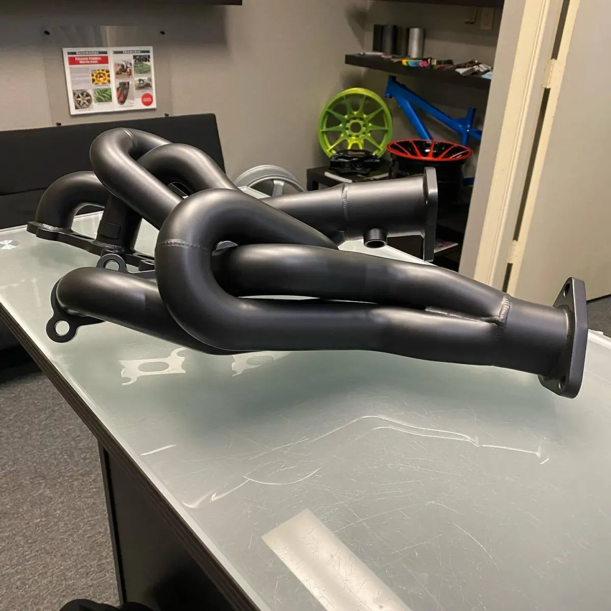 V6 headers refinished in Glacier Black high temp Cerakote for @jotechmotorsports