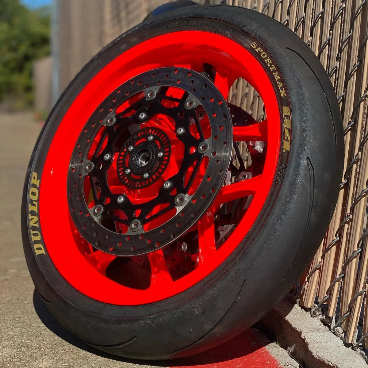 Yamaha YZF-R1M wheels refinished in Fluorescent Red for @co.obsidiandetail. New bearings and tires installed in-house