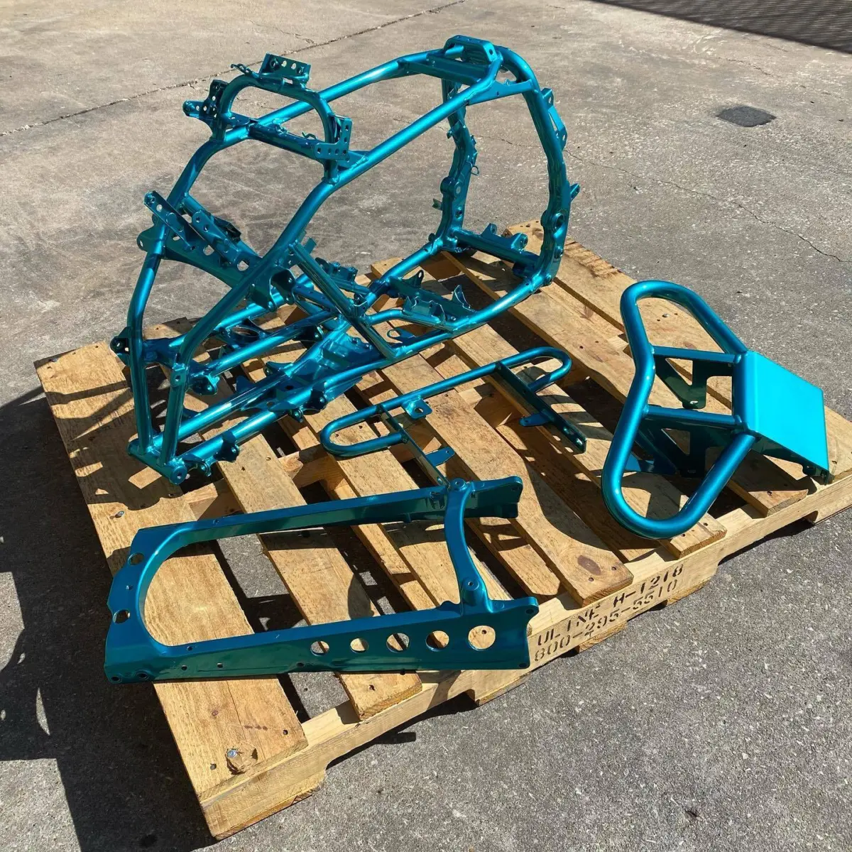 ATV frame repaired and refinished in Candy Teal