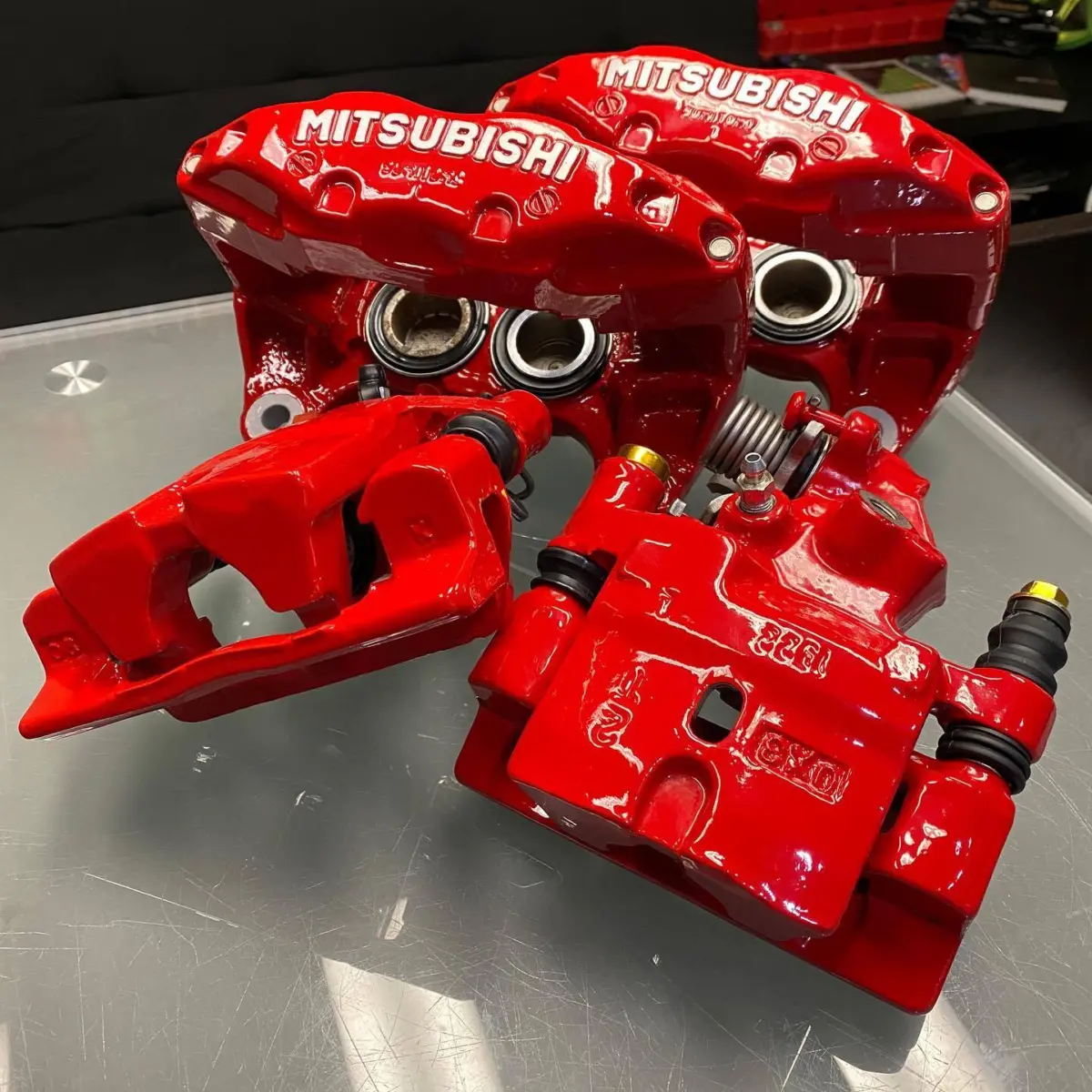 Mitsubishi 3000GT VR-4 calipers refinished in Red and High Gloss Clear with brushed letters