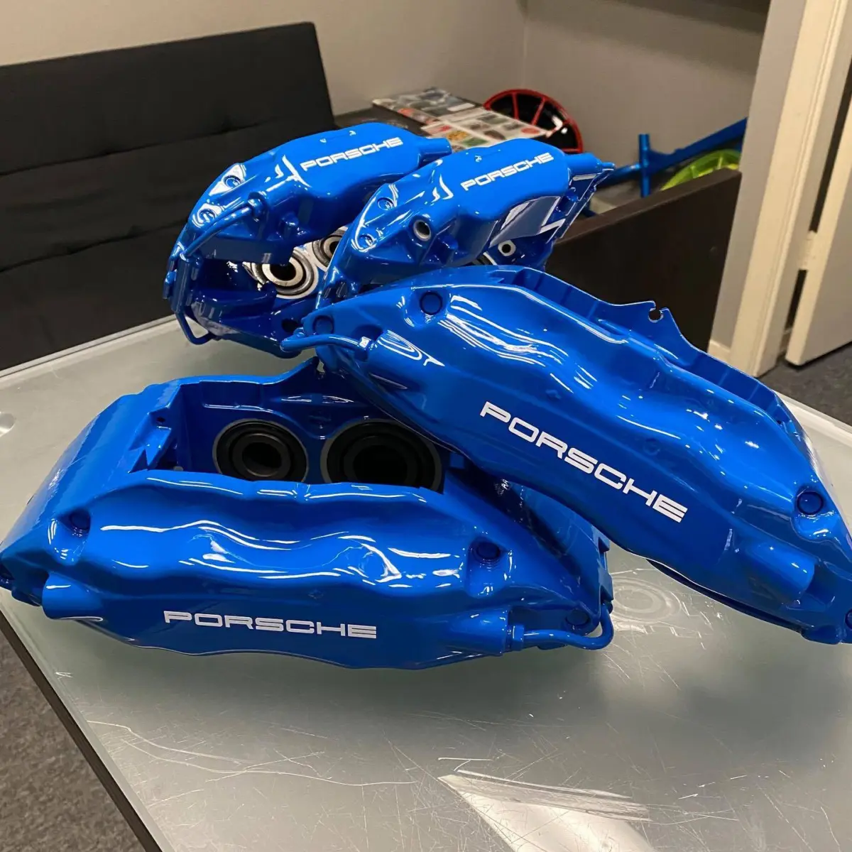 Porsche brake calipers refinished in a RAL 5005 with High Gloss Clear