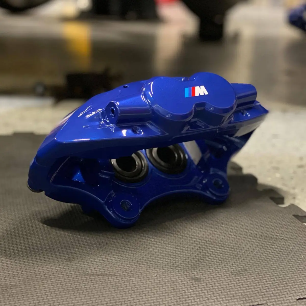 BMW M Sport brakes refinished in a metallic blue