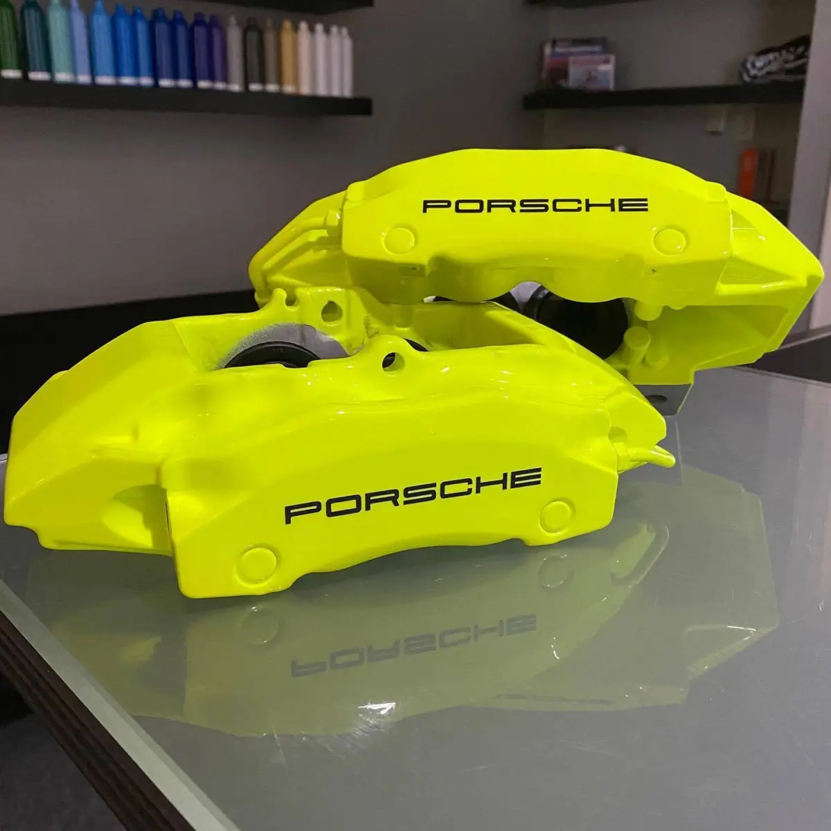 Porsche calipers refinished in Fluorescent Yellow