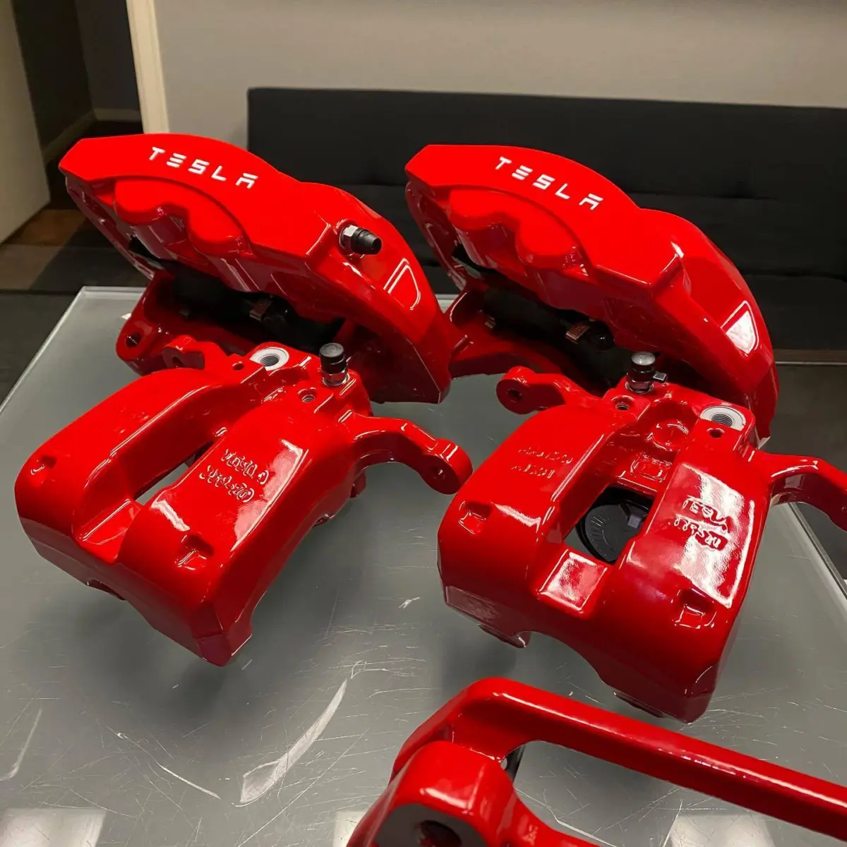 Tesla Model 3 brake calipers refinished in our Bengal Red