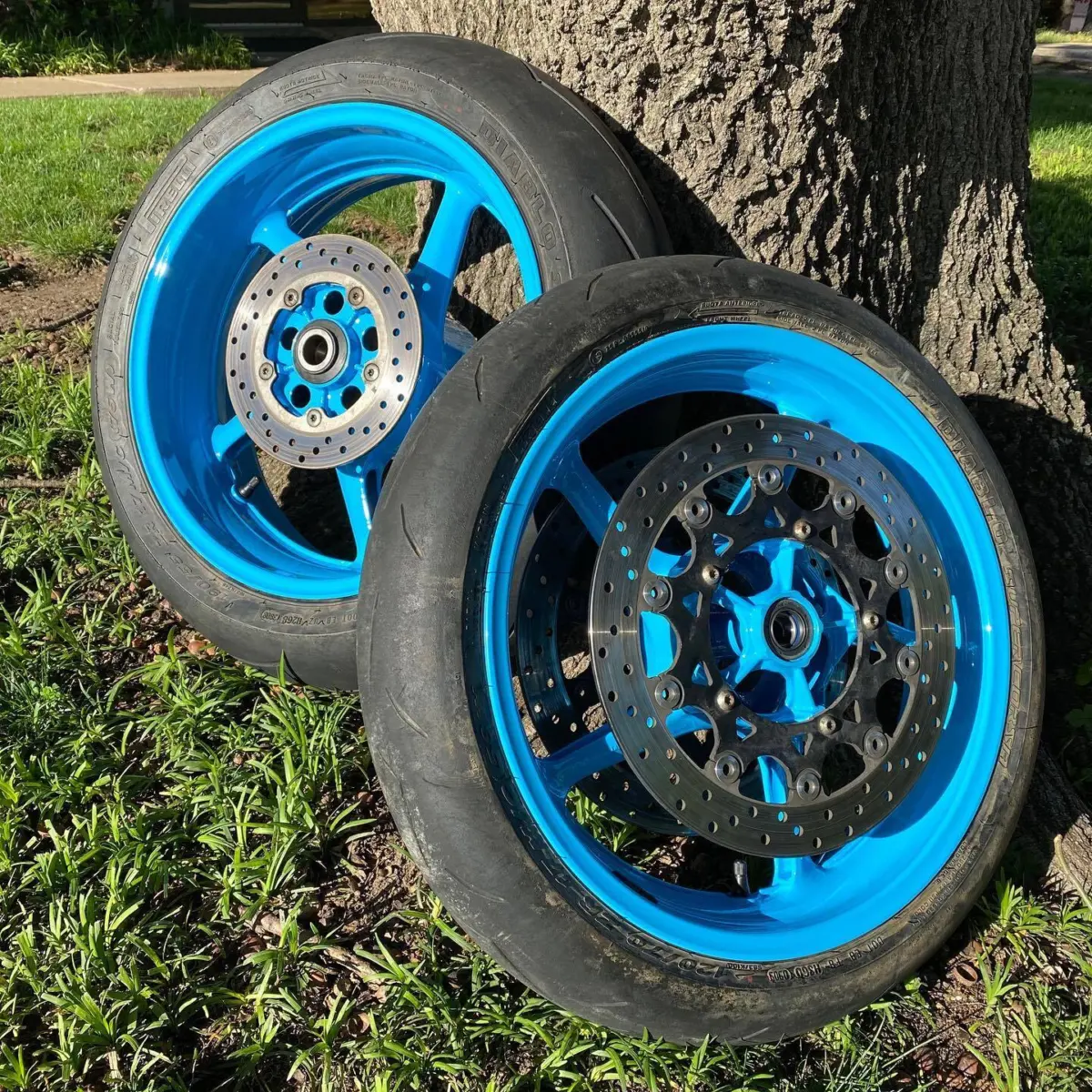Sport bike wheels refinished in Playboy Blue with High Gloss Clear. New bearings and tires mounted in house