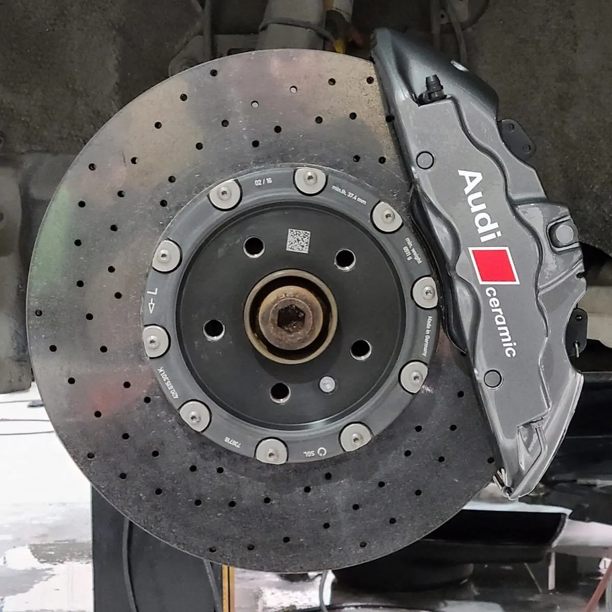 Audi R8 brake calipers refinished in a light metallic gunmetal