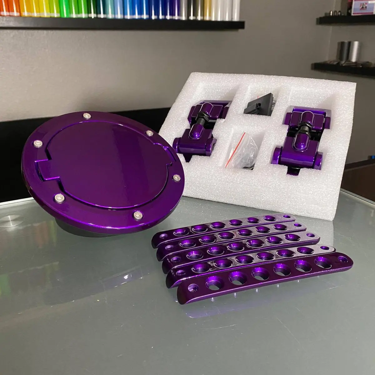 Jeep fuel door, hood latches, and door inserts refinished in Illusion Violet