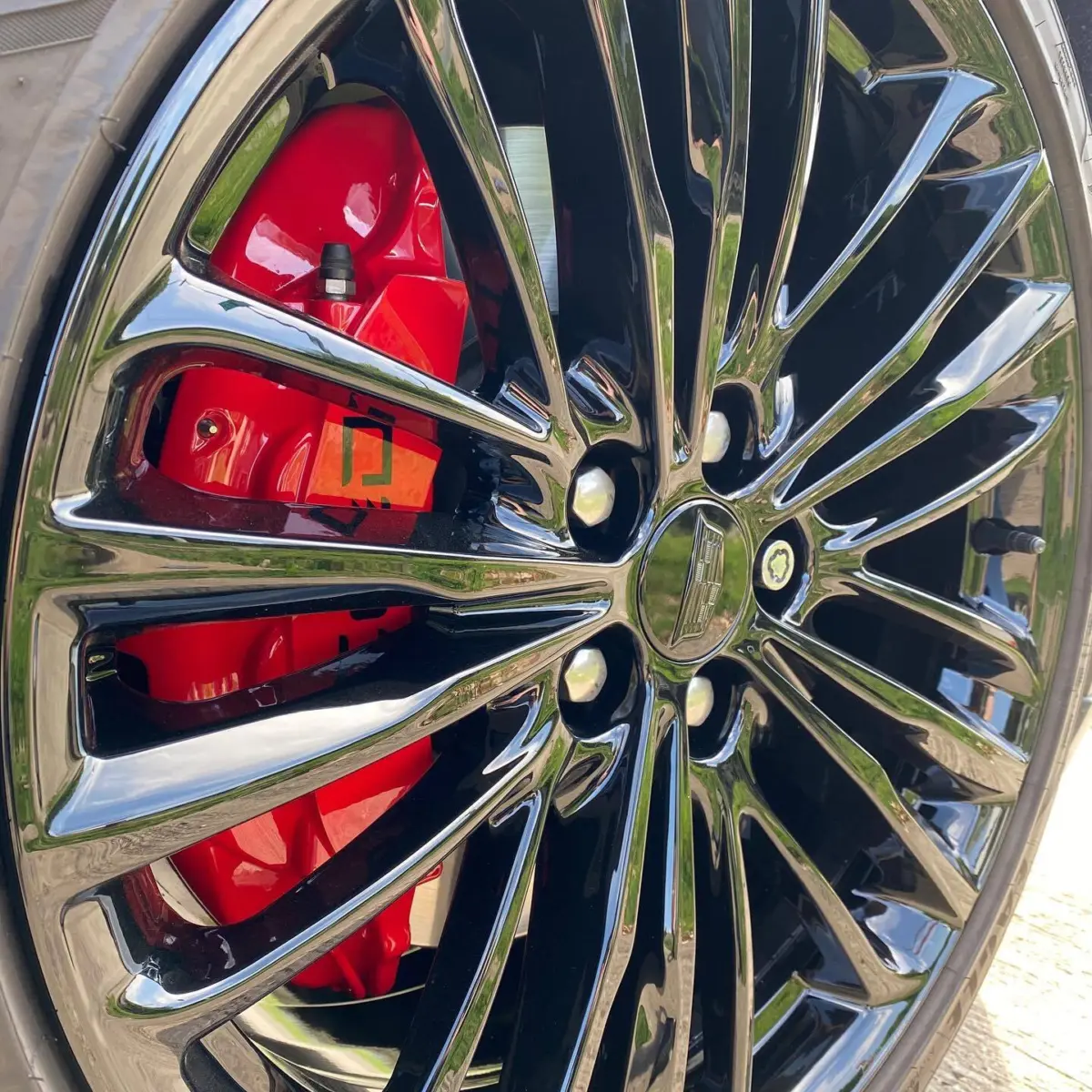 2020 Cadillac CT6 wheels and brake calipers powder coated Wet Black and Red. Center caps were painted to match and calipers were topped off with custom vinyl logos. Next off to @the_detail_lab_tx and @ntxclearbra for wrap and final touches!