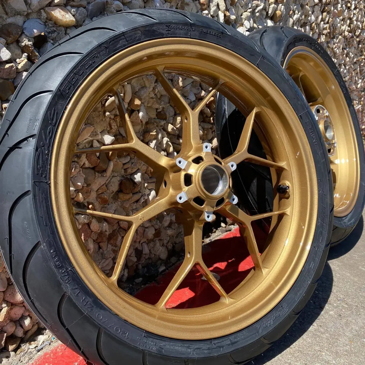 Sport bike wheels refinished in Prismatic Gold. Tires mounted in house with our No Mar tire changer