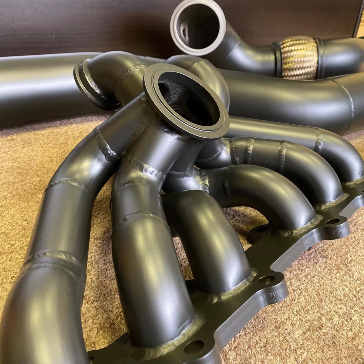 Toyota Supra 2JZ headers and exhaust pipes finished in Glacier Black Cerakote for @jotechmotorsports