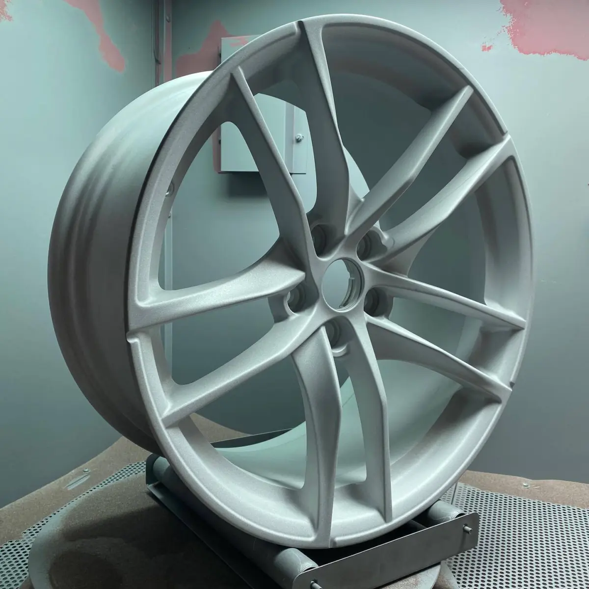 Freshly sandblasted wheel ready for powder coat. Who knows what car this is for?