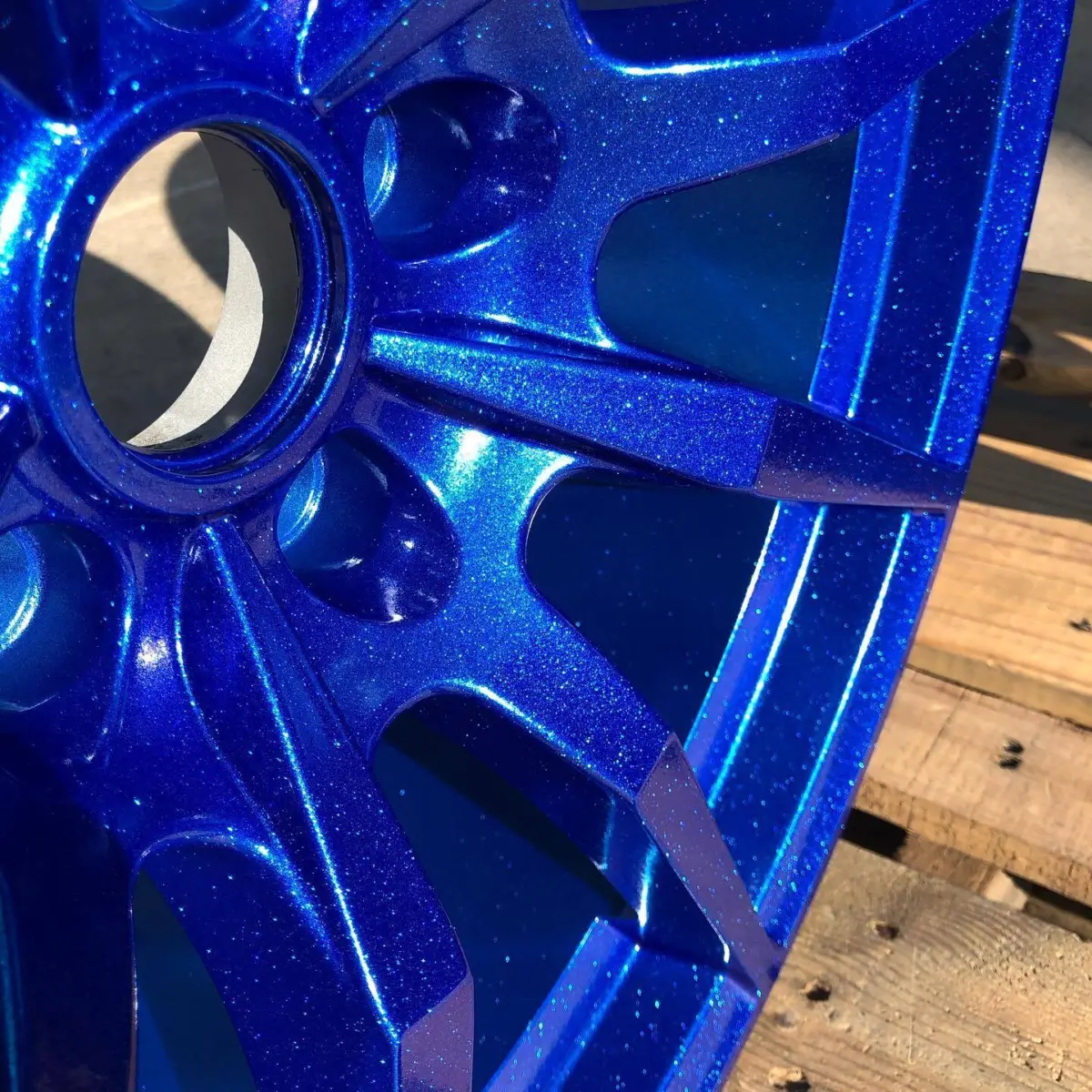 SVE S350 wheels refinished in a custom blue with a chameleon violet-teal color shift