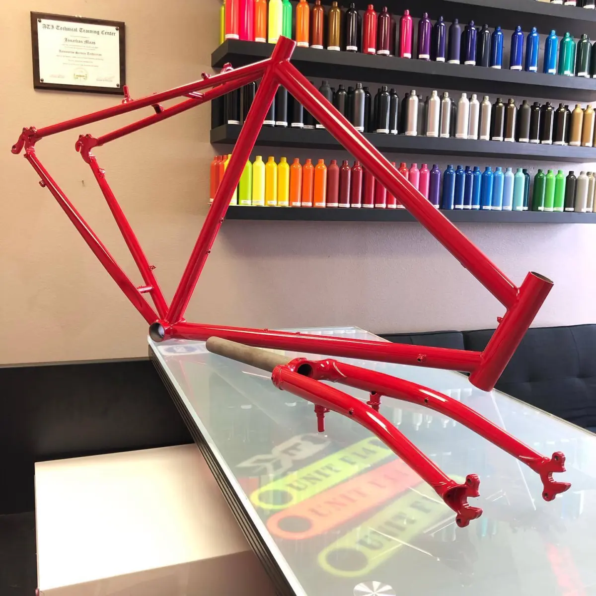 Surly bicycle frame refinished in our a House Red with high Gloss Clear