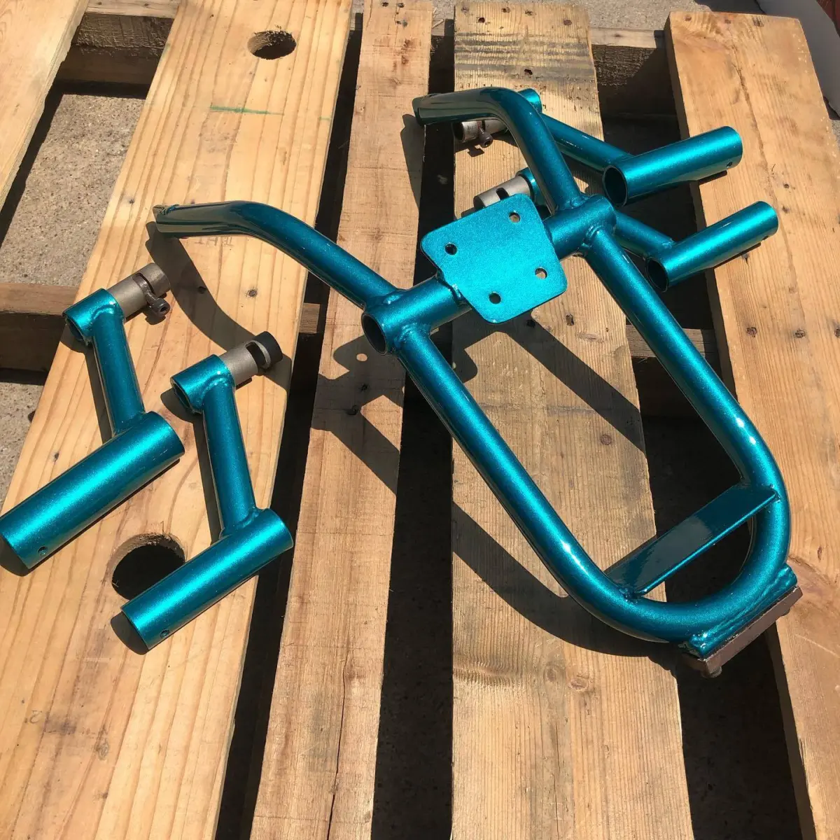 Subcage and pegs refinished in a Metallic Teal