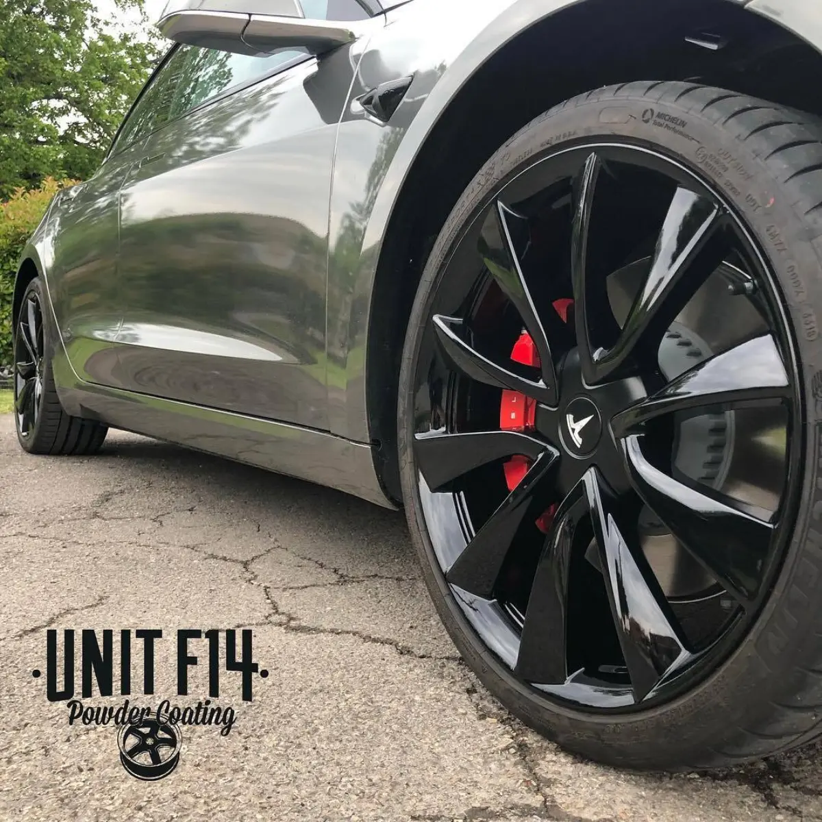 Tesla Model 3 wheels refinished in Wet Black