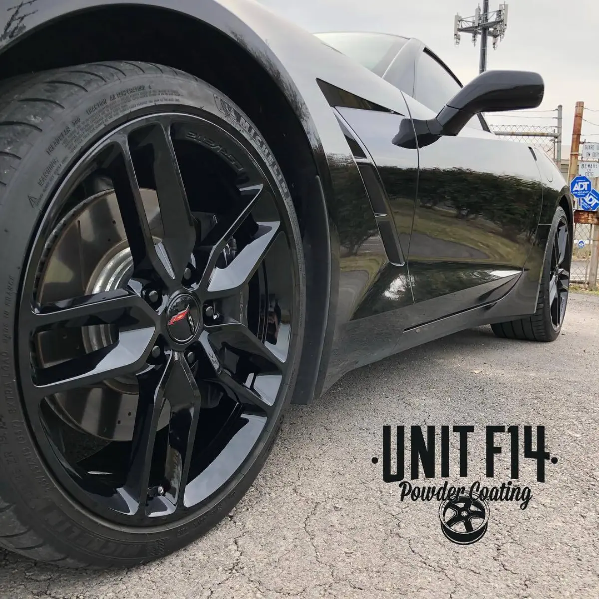 Corvette wheels refinished in Wet Black