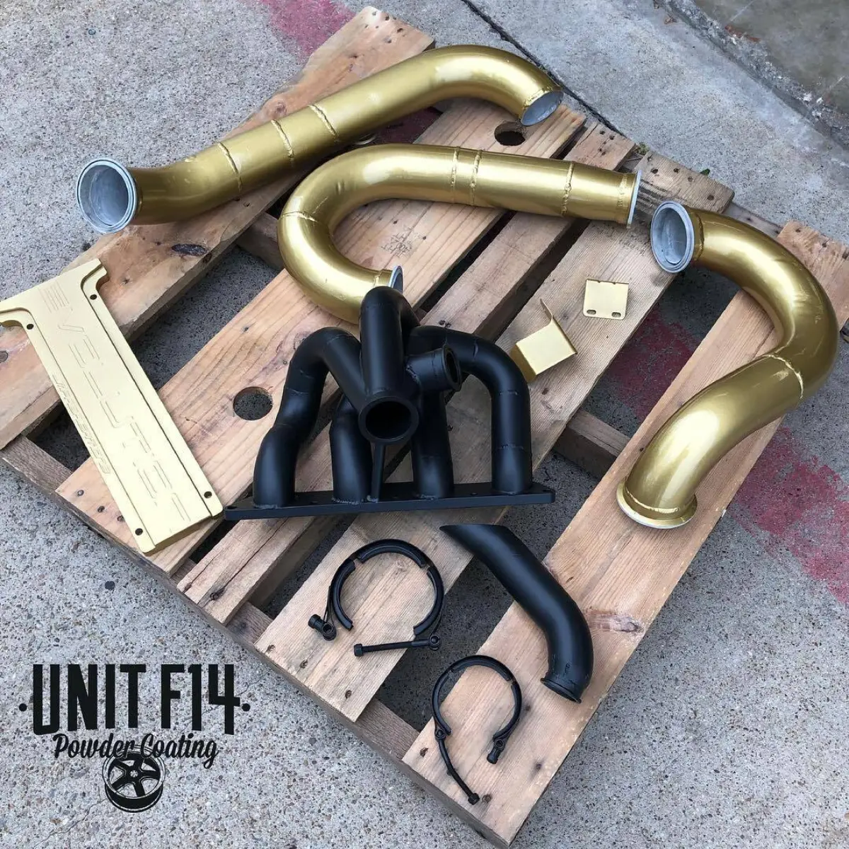 Intake piping and coil cover refinished in Metallic Gold powder coat, exhaust manifold and clamps in Glacier Black Cerakote