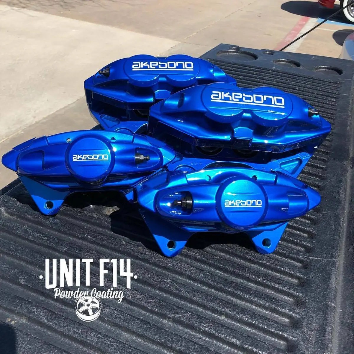 Akebono brake calipers mailed in from Missouri rebuilt and refinished in Peeka Blue