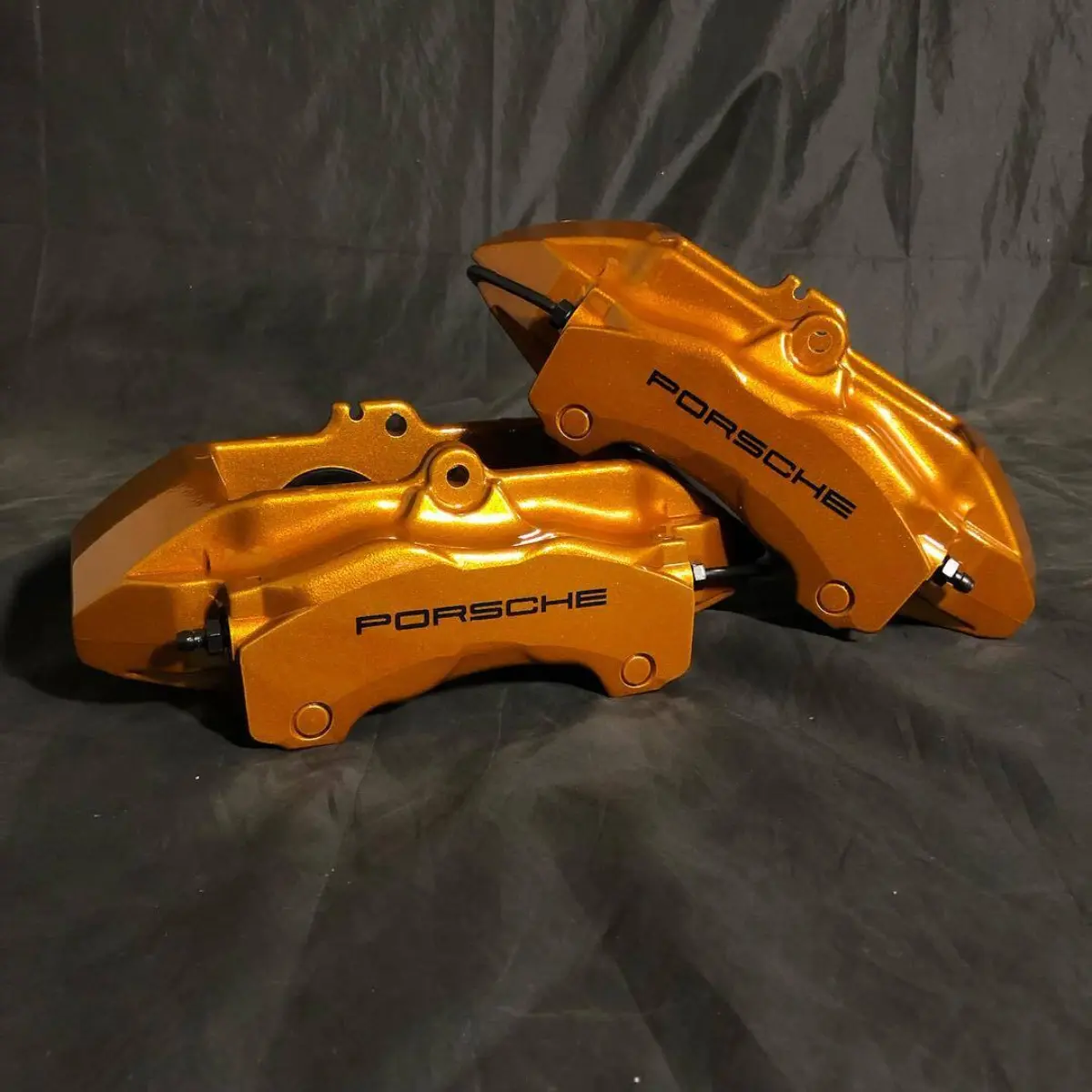 Porsche brake calipers refinished in Illusion Spanish Fly