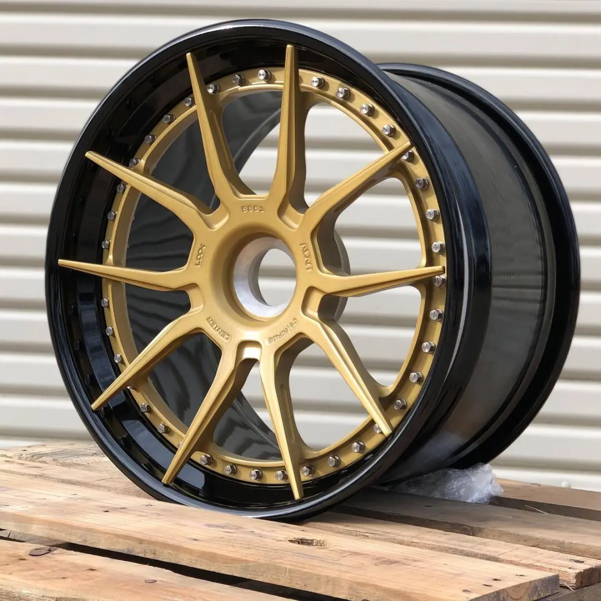 Porsche ADV1 three-piece wheels refinished with Satin Gold faces and Wet Black lips/barrels