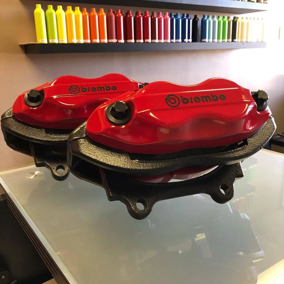 Full service brake refinishing for this Dodge Challenger R/T Scat Pack. Front and back halves is our popular house red along with Cerakote middle halves and hardware and Brembo vinyl logos