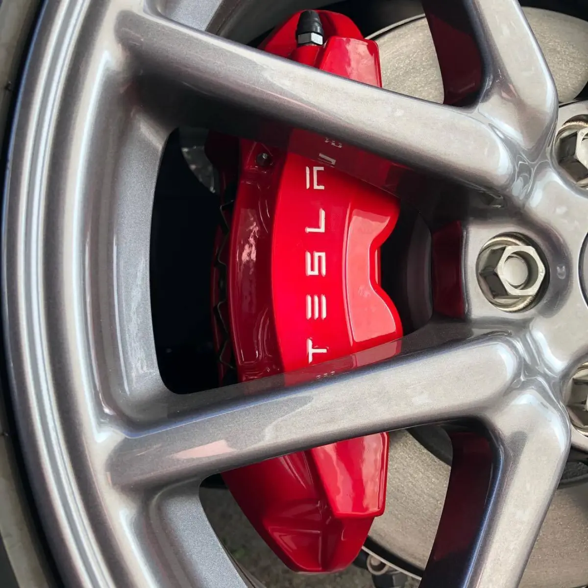 Powder coated brake calipers for a Tesla Model 3