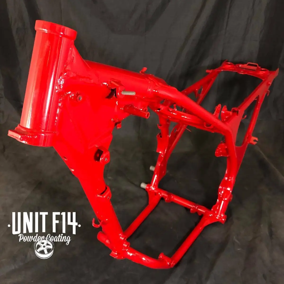 Old Honda three-wheeler frame refinished in our house red