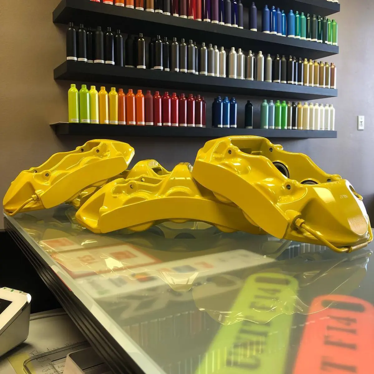 Brake calipers refinished in Hot Yellow
