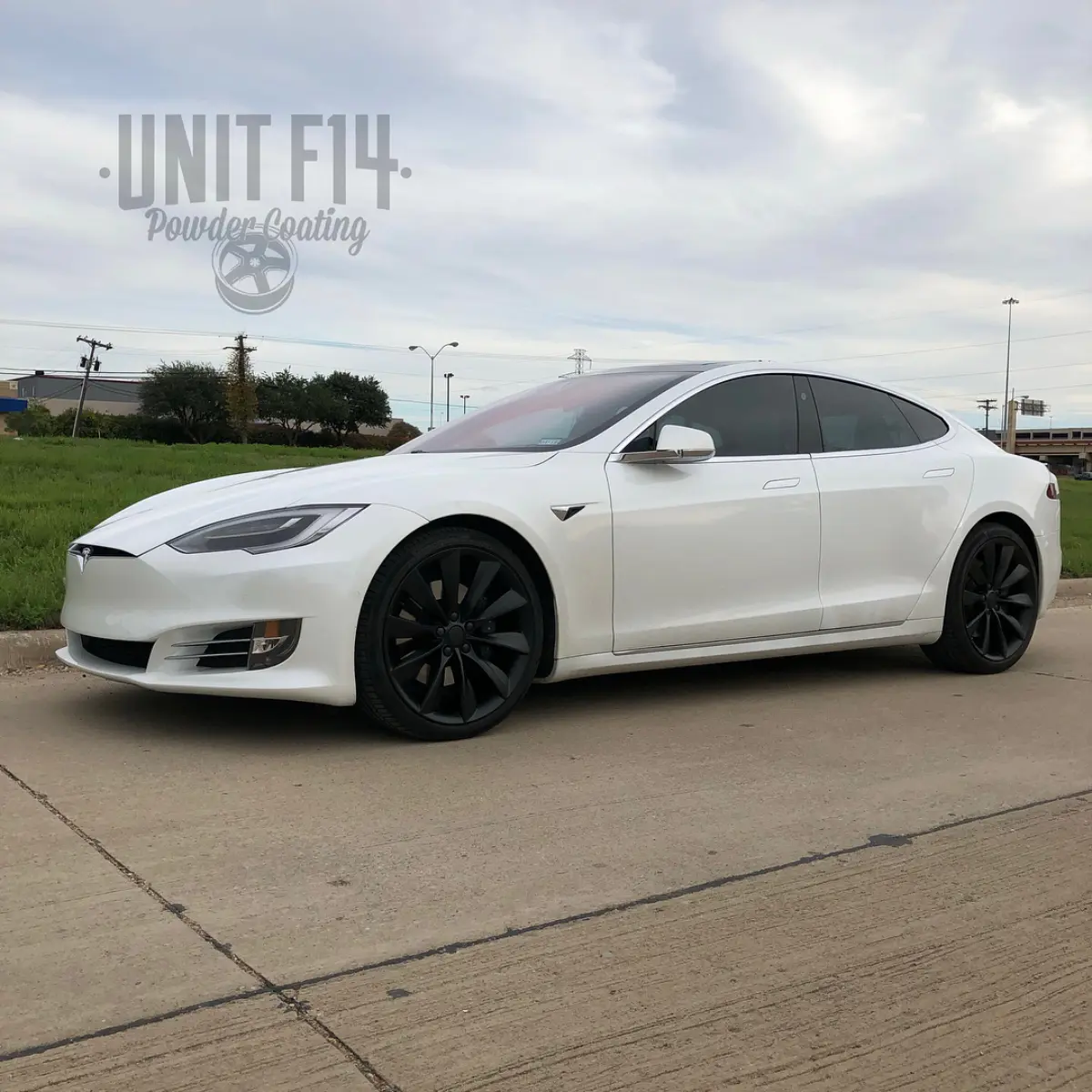 21” Tesla wheels refinished in Denim Black