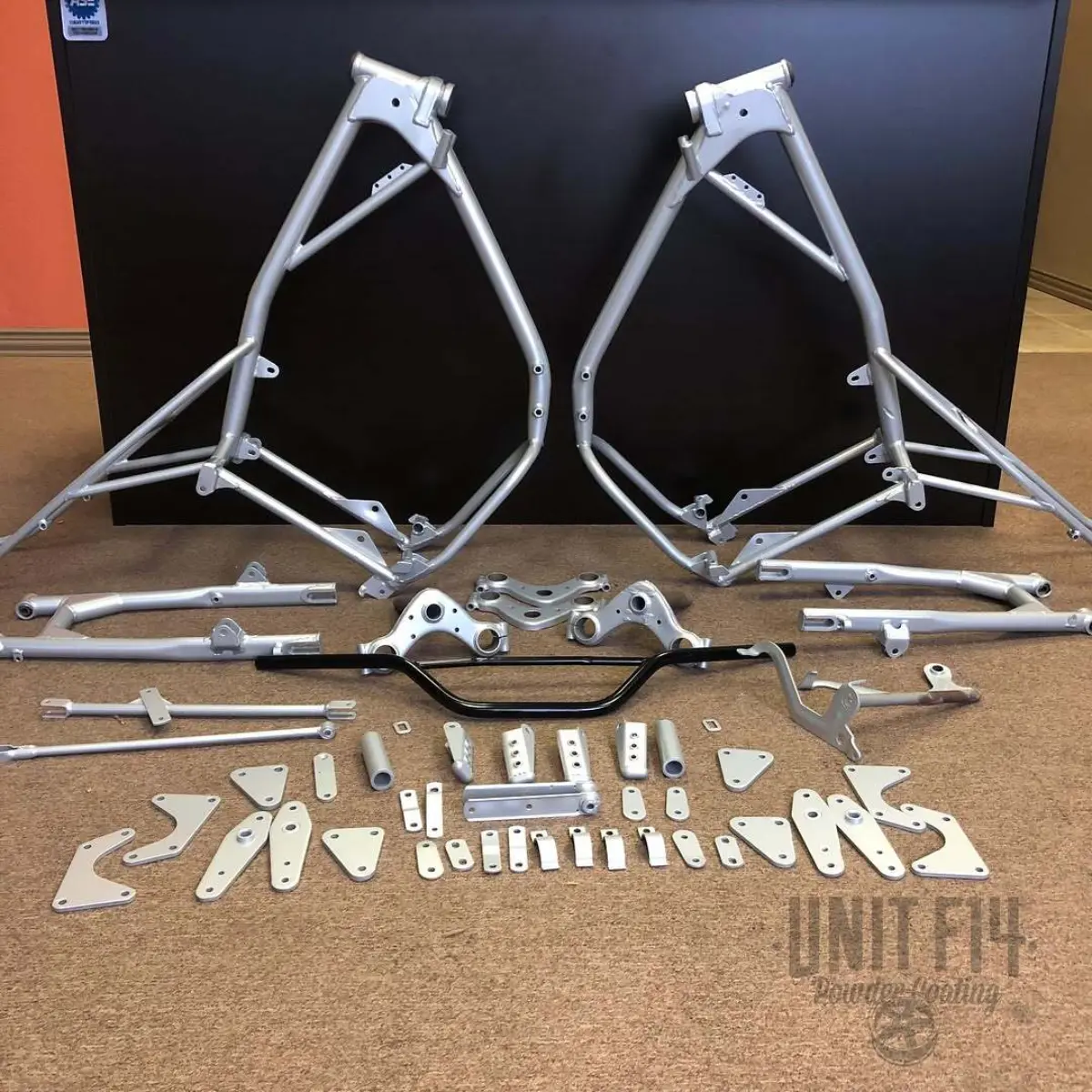 Swipe for before old Husqvarna dirt bikes restored in anodized silver with a zinc primer