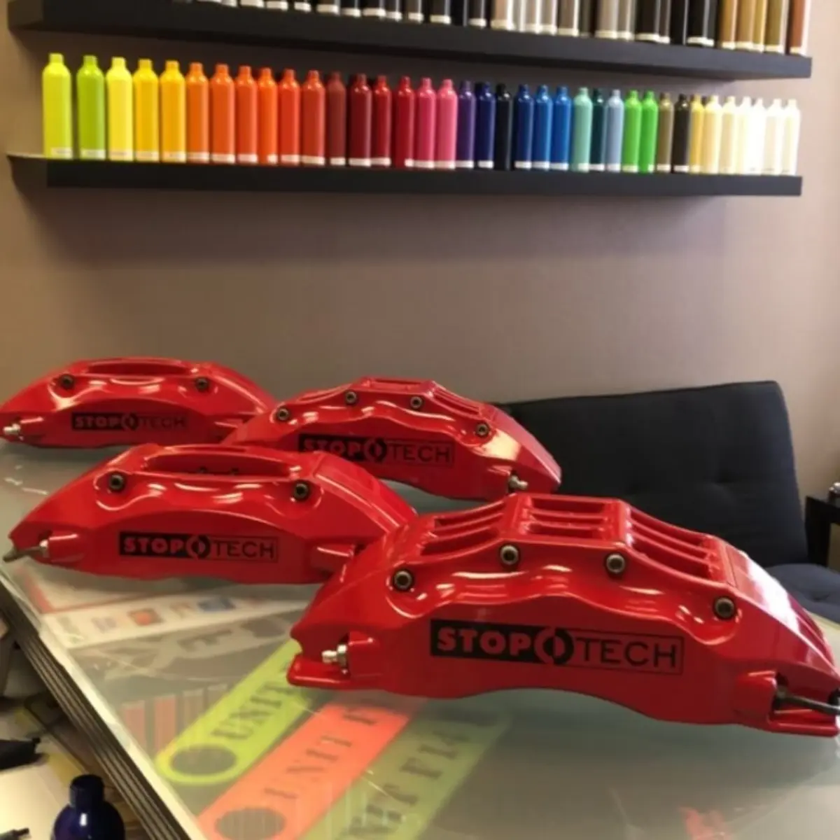 Stoptech brake calipers rebuilt and refinished in our house red with vinyls under clear